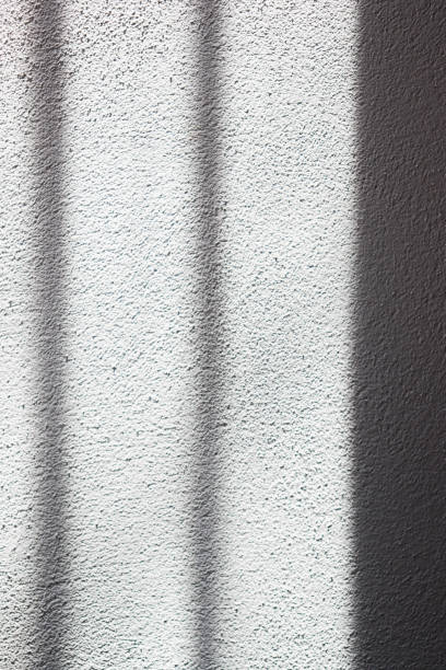 istock Hard shadows on the surface of the wall. 2141428196