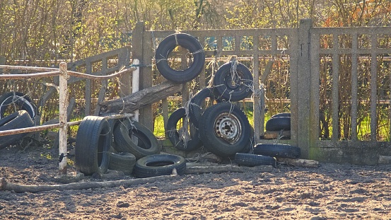 Worn Out Rubber Car Tyres Dumped in Backyard