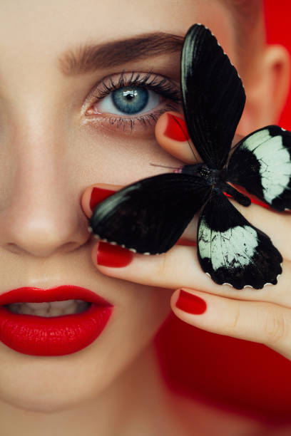istock Young beautiful woman with red lips 2141438880