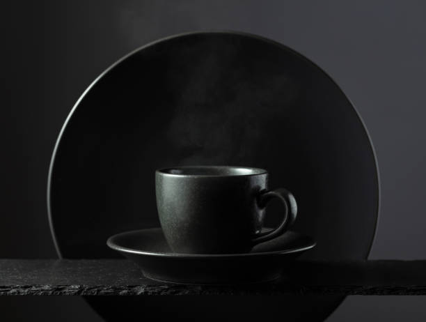 istock Cup of black coffee on a black background. 2141444732