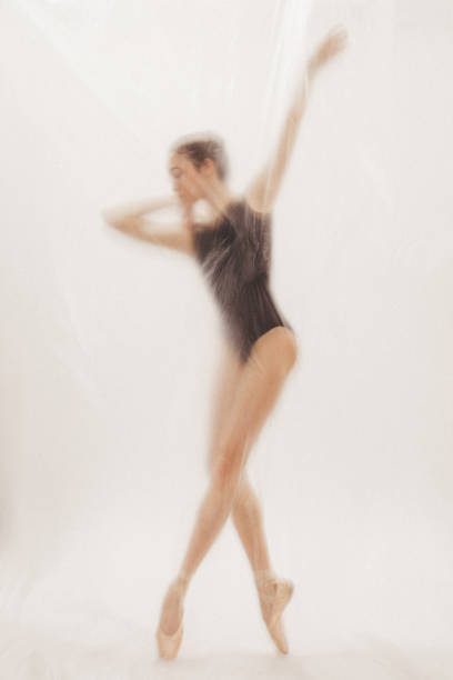 istock Beautiful ballerina dancing on the stage 2141445809