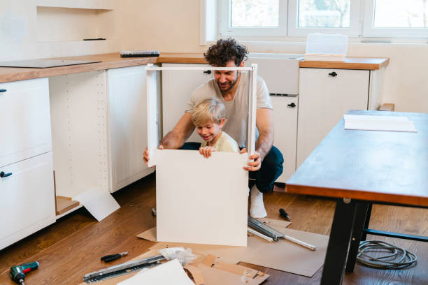 istock Father and son assembling kitchen furniture 2141465230