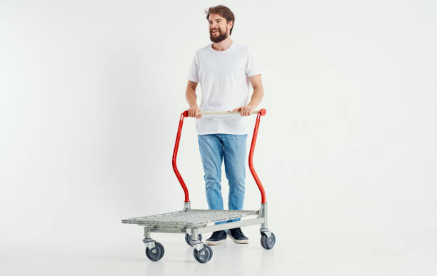 istock a man in a cargo trolley on a light background superhero transporting heavy objects 2141486777
