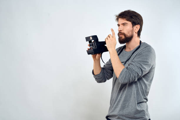 istock Male photographer professional camera work Studio Technology modern art light background 2141492588