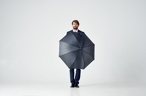 man with open mouth classic suit model in full growth on a light background. High quality photo