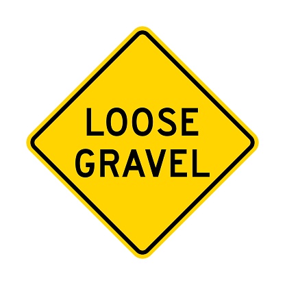 Loose gravel road sign isolated on white background