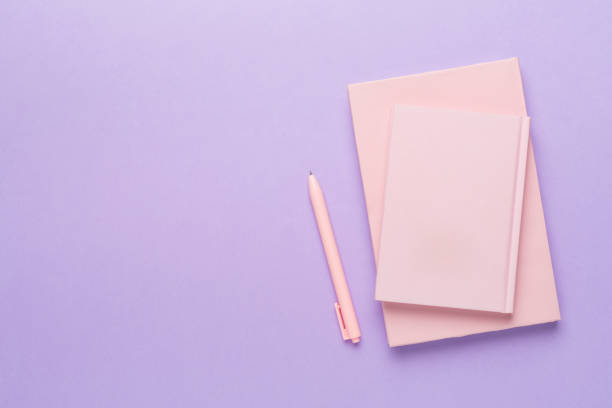 istock Notebooks with stationery on color background, top view 2141504906
