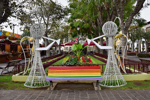 Bench in rainbow colors at Constitution Square, Orotava nicely decorated at Christmas time. Tenerife, Canary Islands, Spain, travel Europe