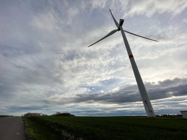 Wind turbine against a cloudy sky.This image was taken with a mobile phone.
