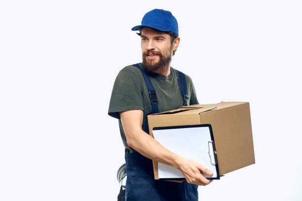 istock Working male courier with box in hand documents delivery service light background 2141551646
