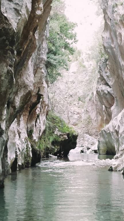 Discover a hidden narrow canyon, emerald waters flowing through. Perfect for those seeking serene canyon, emerald scenes. Unique canyon, emerald water captures tranquility