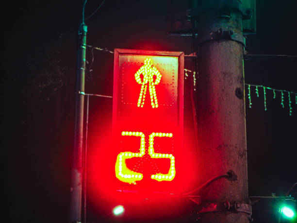 night traffic light for pedestrians with number 25, twenty five.
