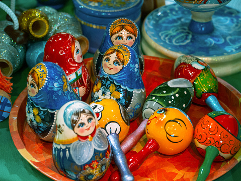 Various beautiful matryoshka dolls for sale on the shelf in a souvenir shop