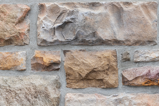 Stone wall textured background, building exterior close up