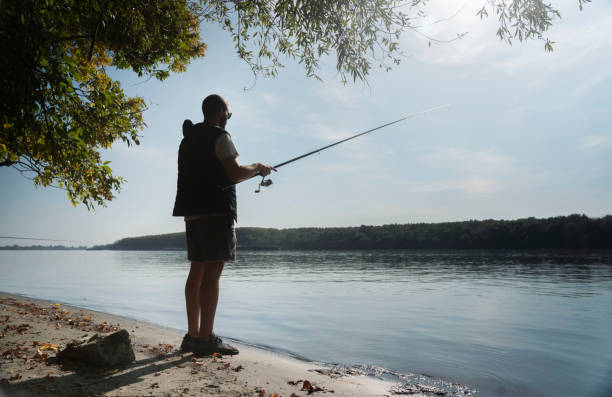 istock A young man fishing 2141593787