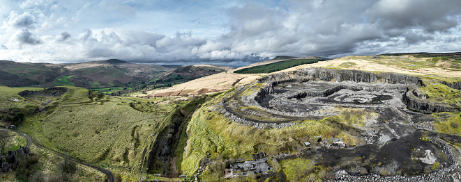 Panoramic view of a large open cast limestone quarry at Penwyllt in the Upper Swansea Valley in South Wales UK