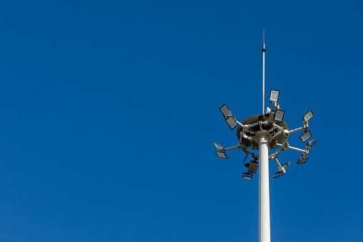 Urban Safety: Light Pole with Lighting Rod Against Dramatic Weather, Blue Sky