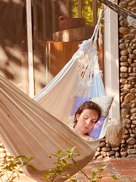istock Woman resting in a typical Colombian hammock 2141628110