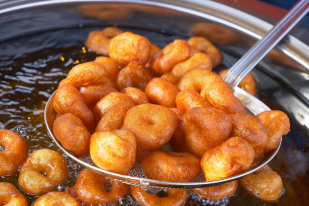 istock Traditional fried sweets lokma in sugar syrup 2141655622