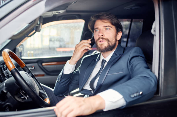 istock successful young man in suit talking on the phone wealth official 2141676774