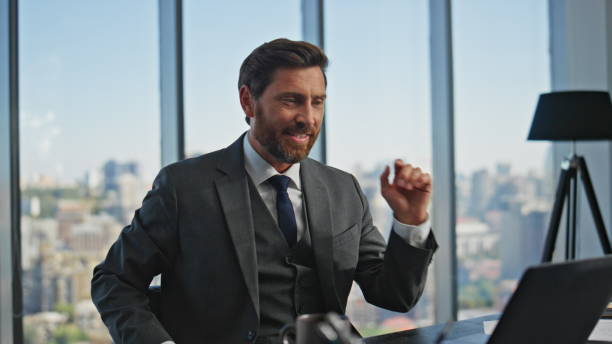 istock Sales man talking web conference in panoramic office. Smiling manager calling 2141685298