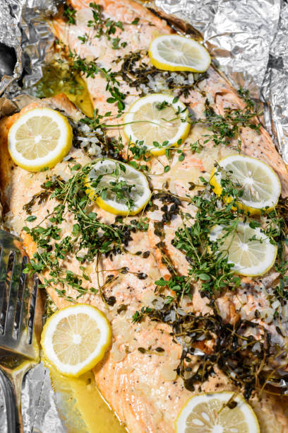 istock Baked Salmon with lemon and herbs in foil 2141694226