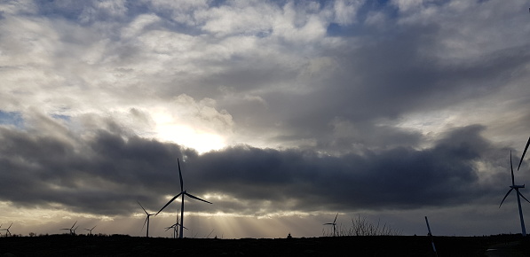 Dramatic sky at an onshore windfarm, Whitelee Wind Farm, south of Glasgow, Scotland England