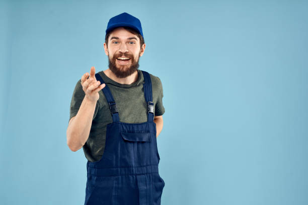 istock man in work uniform uniform professional work lifestyle delivery service blue background 2141709481