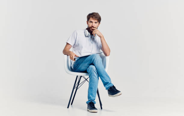 istock Man sitting on chair laptop technology communication lifestyle 2141711050