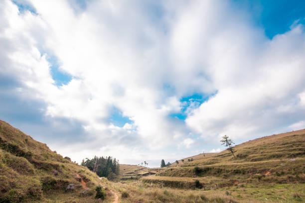 The small path on the mountaintop and the cloudy sky