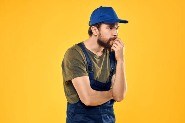 istock man in work uniform rendering service forklift work lifestyle yellow background 2141747710