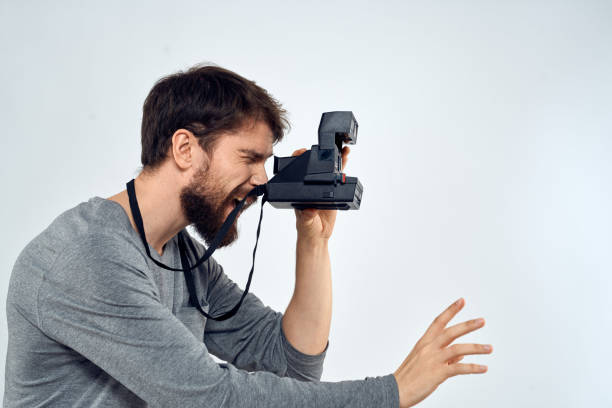 istock photographer with camera hobby technology studio lifestyle creative light background 2141772799