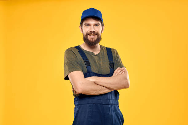 istock man in work uniform rendering service forklift work lifestyle yellow background 2141790308
