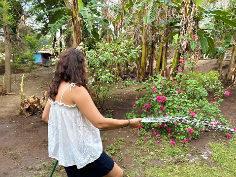 woman watering her garden