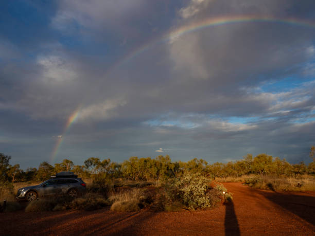 Rainbow and storm clouds in the red dirt, millstream-Chichester National Park, Western Australia