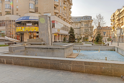Craiova, Romania - March 16, 2024: Water Fountain at King Ferdinand and Queen Maria Square in City Centre at Spring Day.