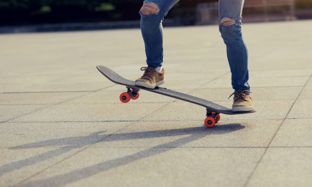istock Skateboarder riding skateboard in city 2141802515