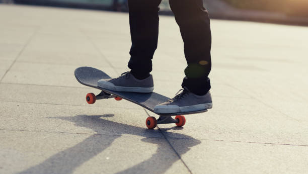 istock Skateboarder riding skateboard in city 2141802541