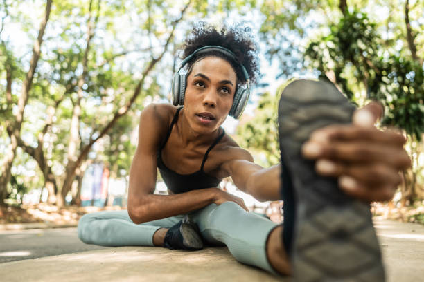 istock Transgender woman stretching at public park 2141827722