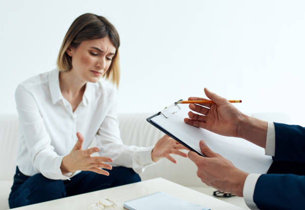 istock a man with documents sits on the sofa and women opposite at the table 2141858251