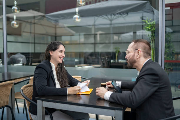 istock Coworkers talking in the cafe 2141860364