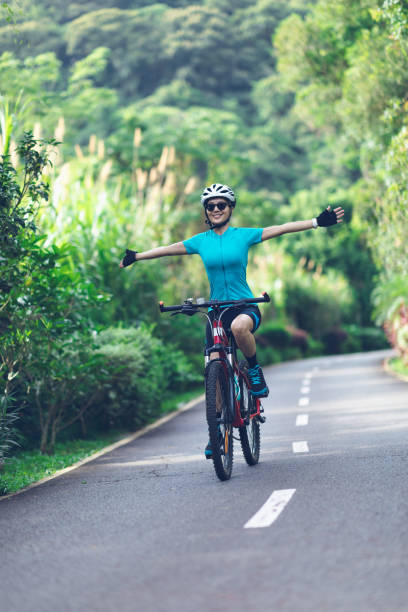 istock Riding bike in summer forest 2141861421