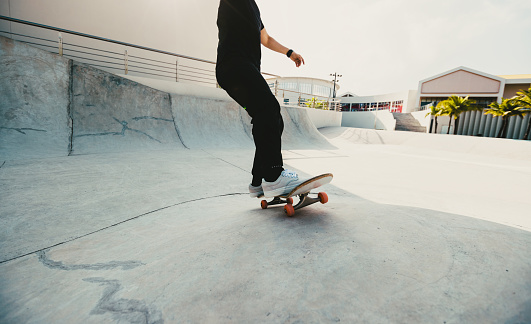 Skateboarder skateboarding at skatepark in city