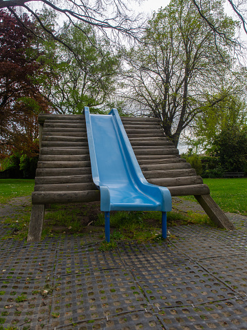 A blue slide in a children's playground