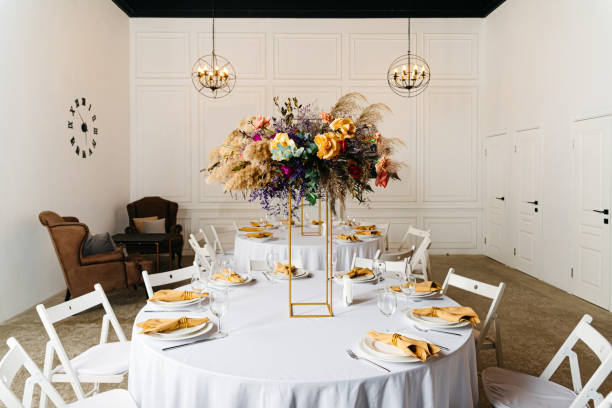 istock Elegant Dining Table Setup with Floral Centerpiece 2141971894