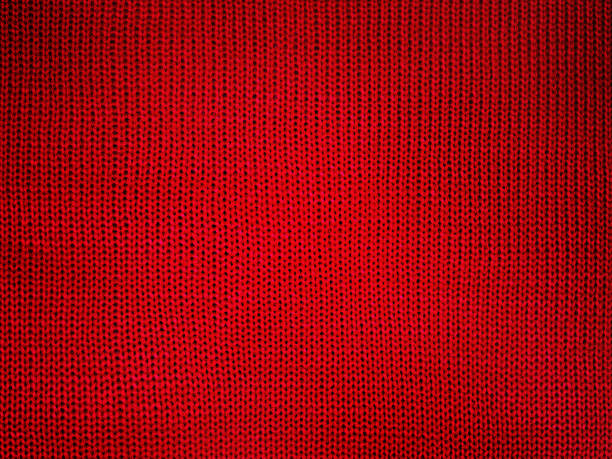 istock Red knitted fabric macro photo as a background. 2141980345