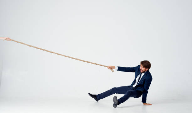 istock man with rope in hand on light background business finance 2141985103