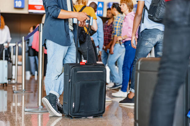 istock Queue Of Travelers Waiting At The Boarding Gate 2142015039