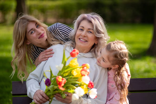 istock Three generations family with tulip bouquet 2142092326