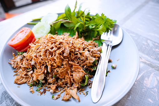 I tried 
Northern Thai-Style Chopped Pork Salad​ (Larb Muang Moo) in Chiang Mai, Thailand as a popular eatery, Pakorn's Kitchen, serves the Thai Dish. It might be called 